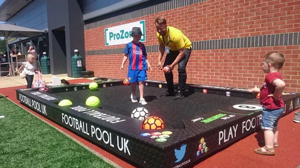 Kids playing footpool