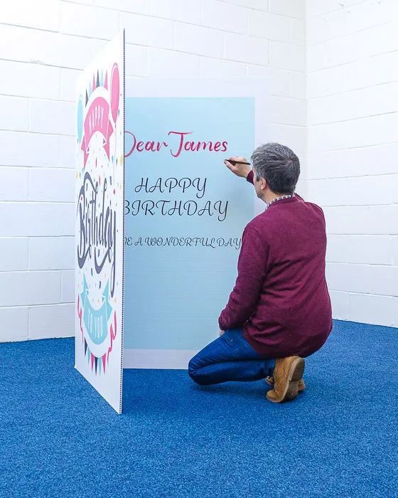 Giant greeting card next to a gift
